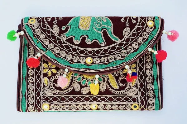 Chic Bags For Office Professionals And Urban Dwellers Elephant Tiki Clutch