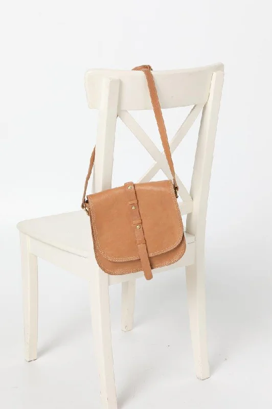Compact Bags For Minimalist Travelers Cosgrove & Co Retro Mini Leather Saddle Bag | Collete Camel